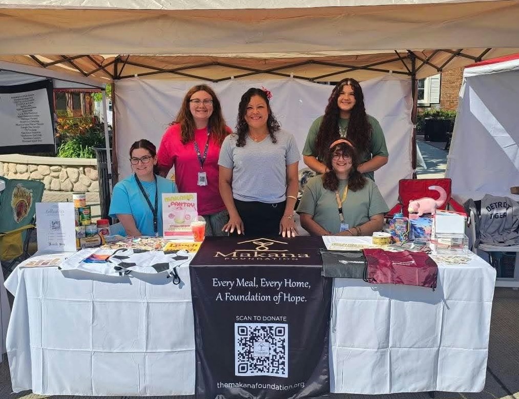 Makana Foundation volunteers at the Every Meal, Every Home booth at a community event